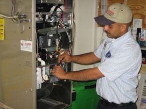 Aladdin AC technician working on a home hot water heater